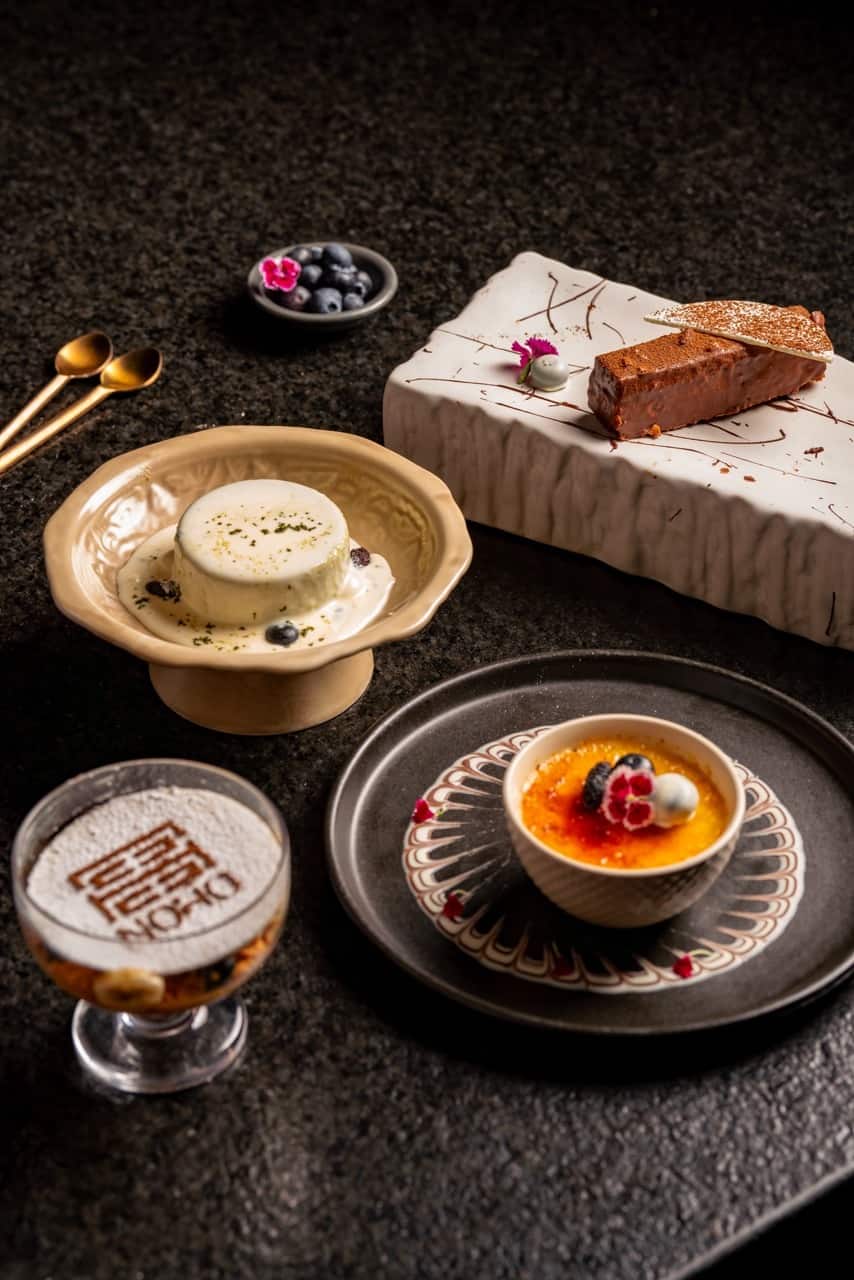 Dessert plates including a NOHO-branded dessert cup