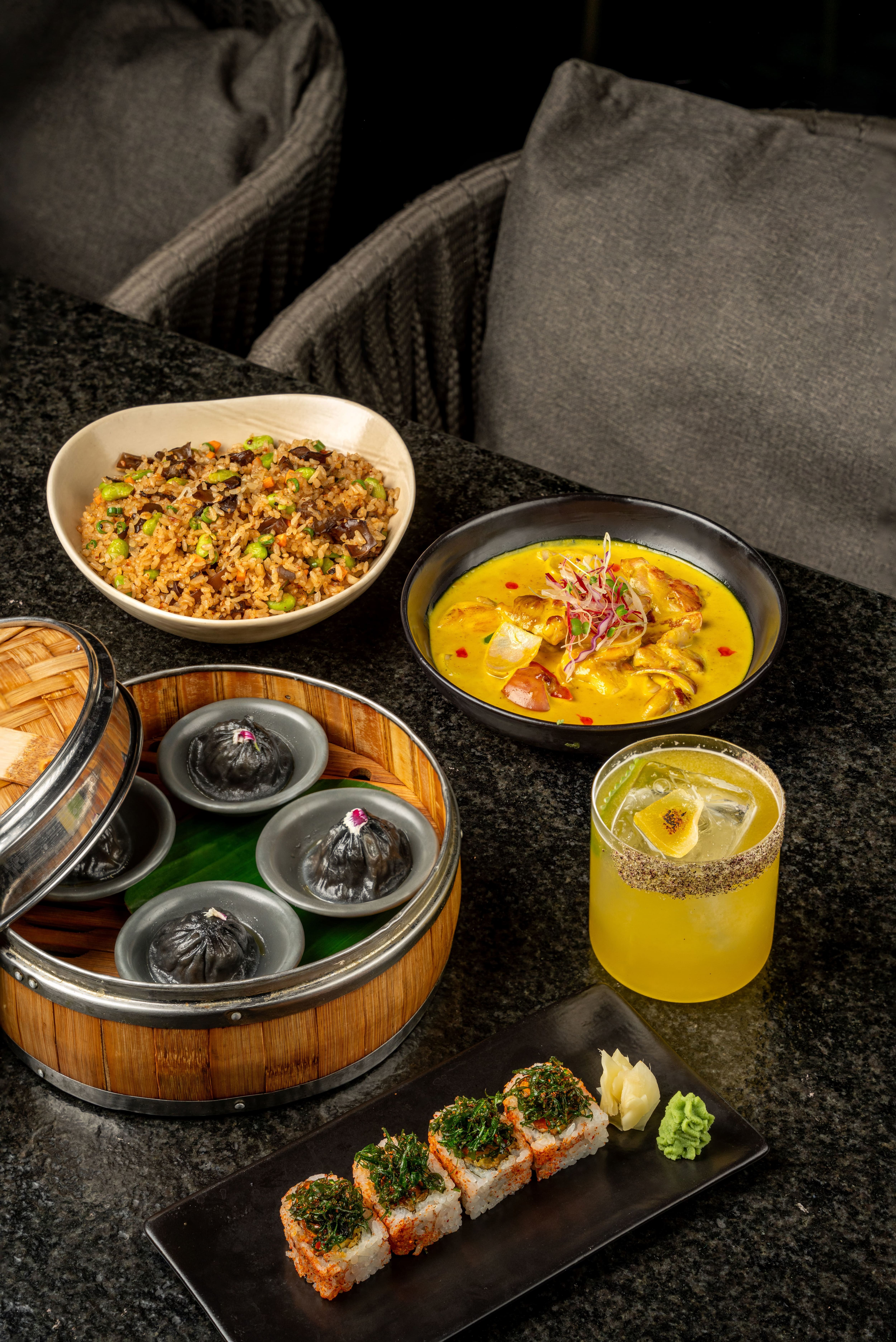 Fried rice, curry, dimsum and sushi with lounge seating at Noho